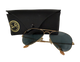 Gold-framed sunglasses with black lenses and a Ray-Ban case on a white background