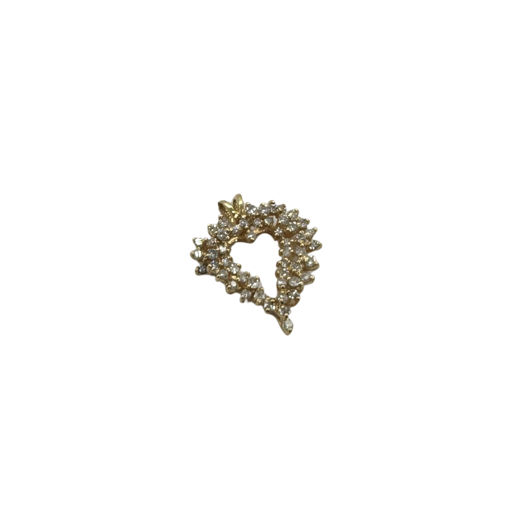 Gold brooch with gemstones on a white background