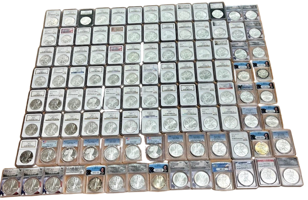 Collection of coins in protective cases on a wooden surface
