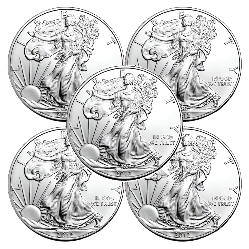 Four silver American Eagle coins with a woman holding an eagle on a white background.