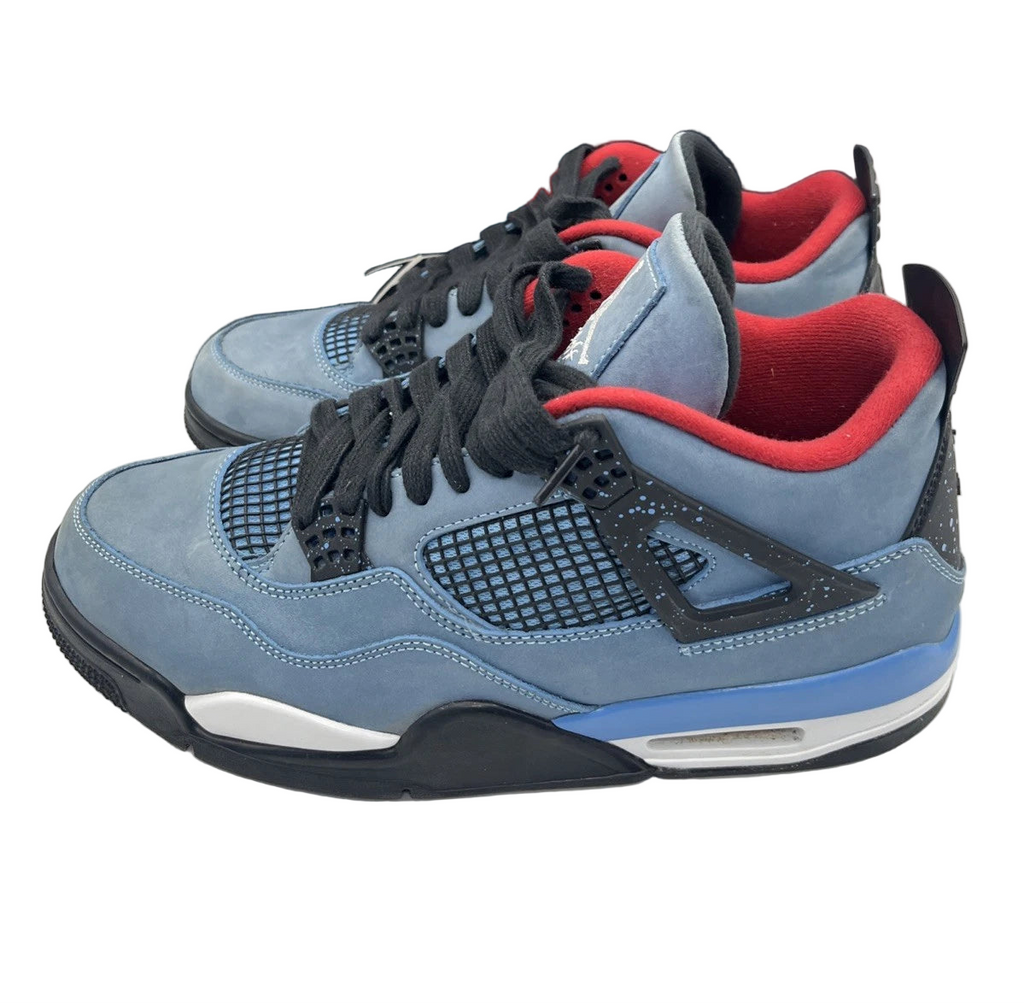 Gray and blue sneakers with red accents and a black Jordan box in the background.