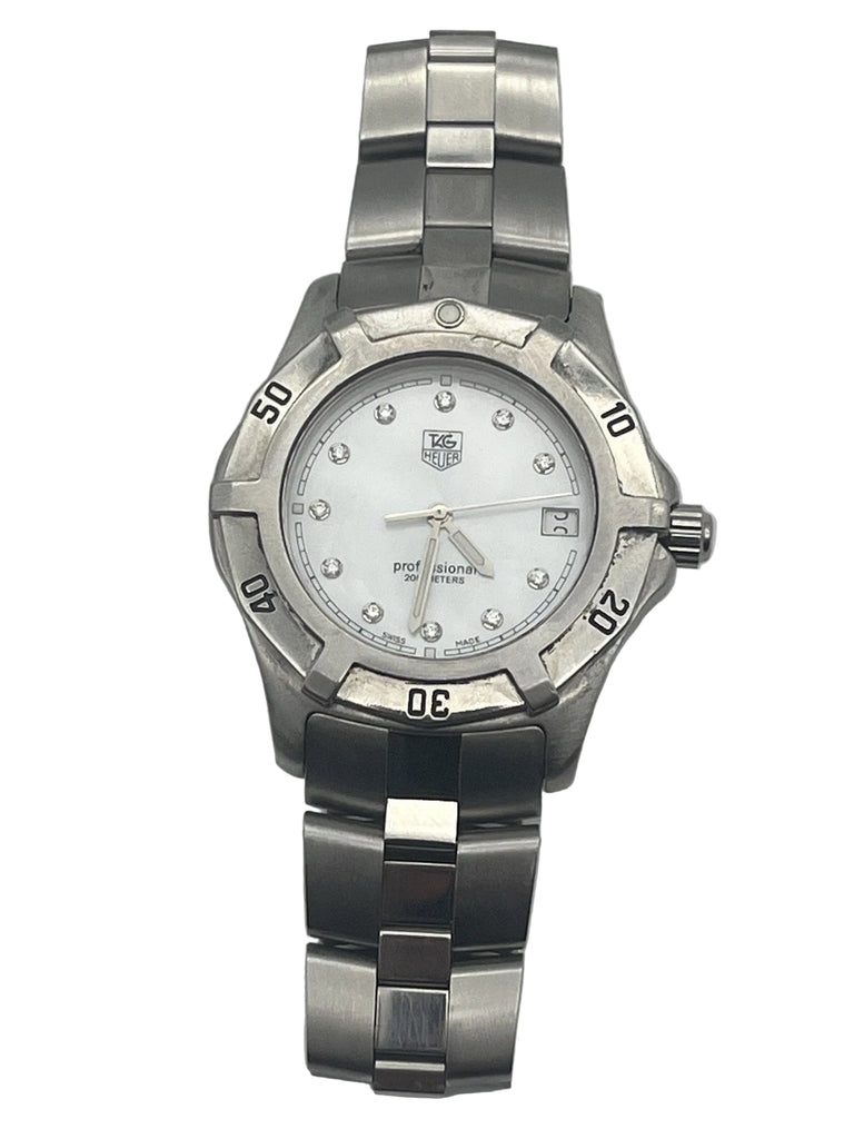 Silver watch with a white face on a light gray background