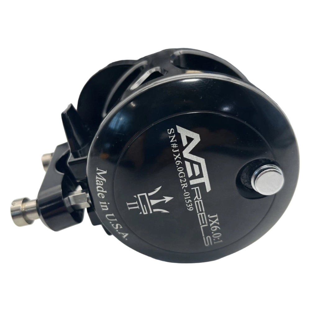 Black fishing reel with 'AET' branding on a white background
