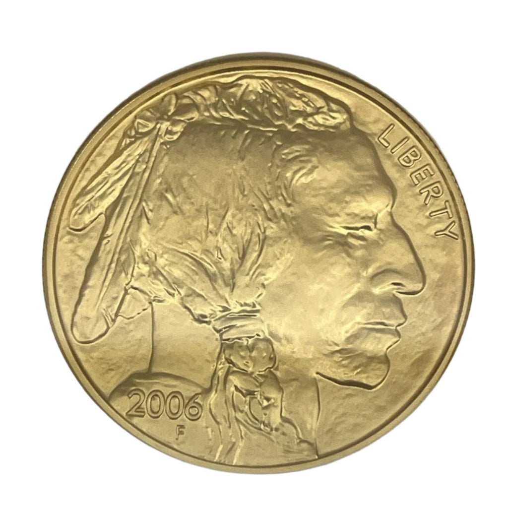 Gold coin with a profile of a Native American and 'Liberty' text, dated 2006, on a gray background.