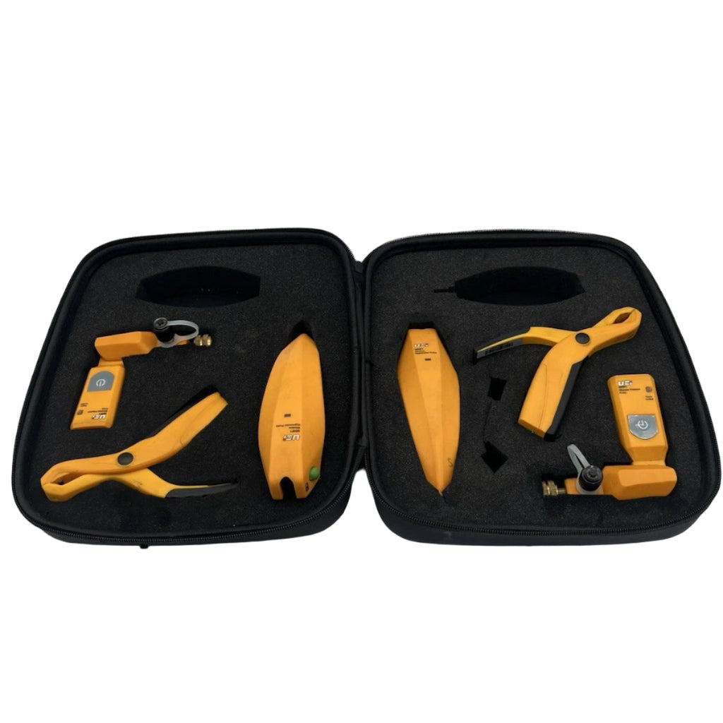 Set of yellow tools in a black case on a white background