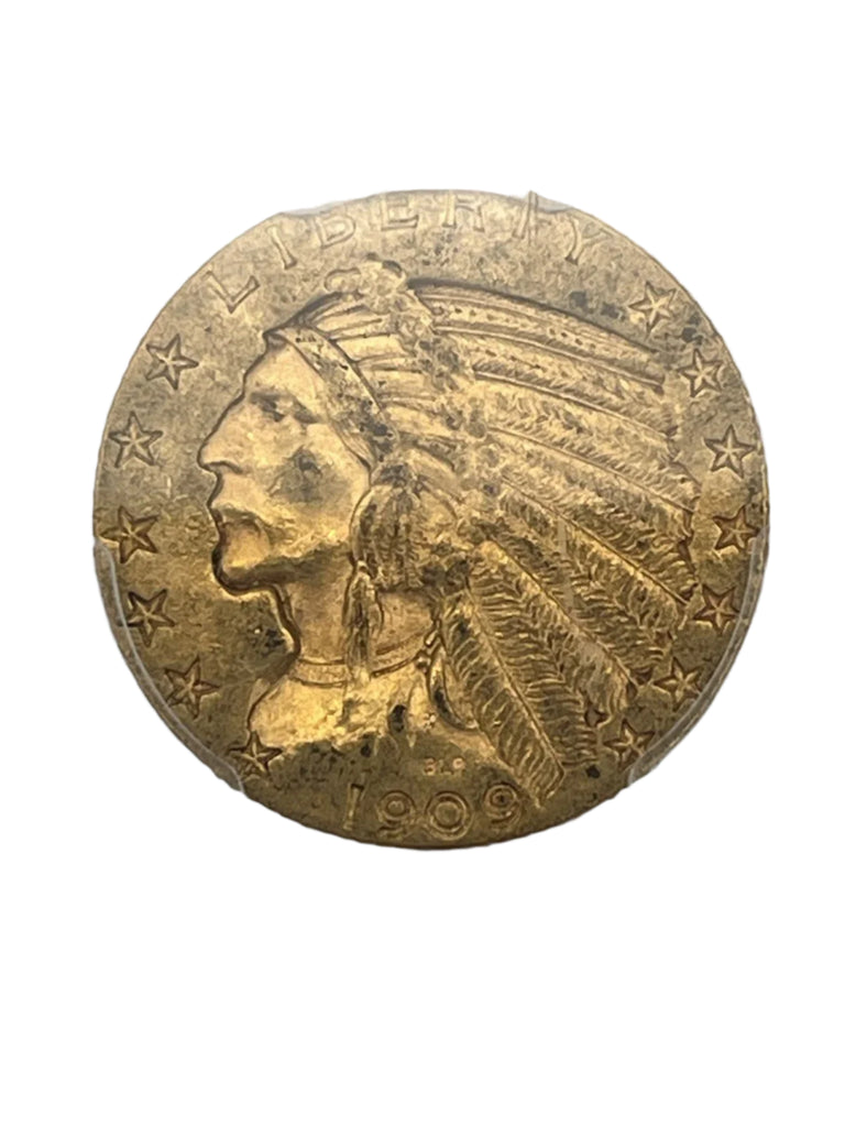 Gold coin with a profile of an Indian chief and the year 1909, held in a clear holder.