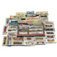 Collection of model train sets and accessories on a blue surface