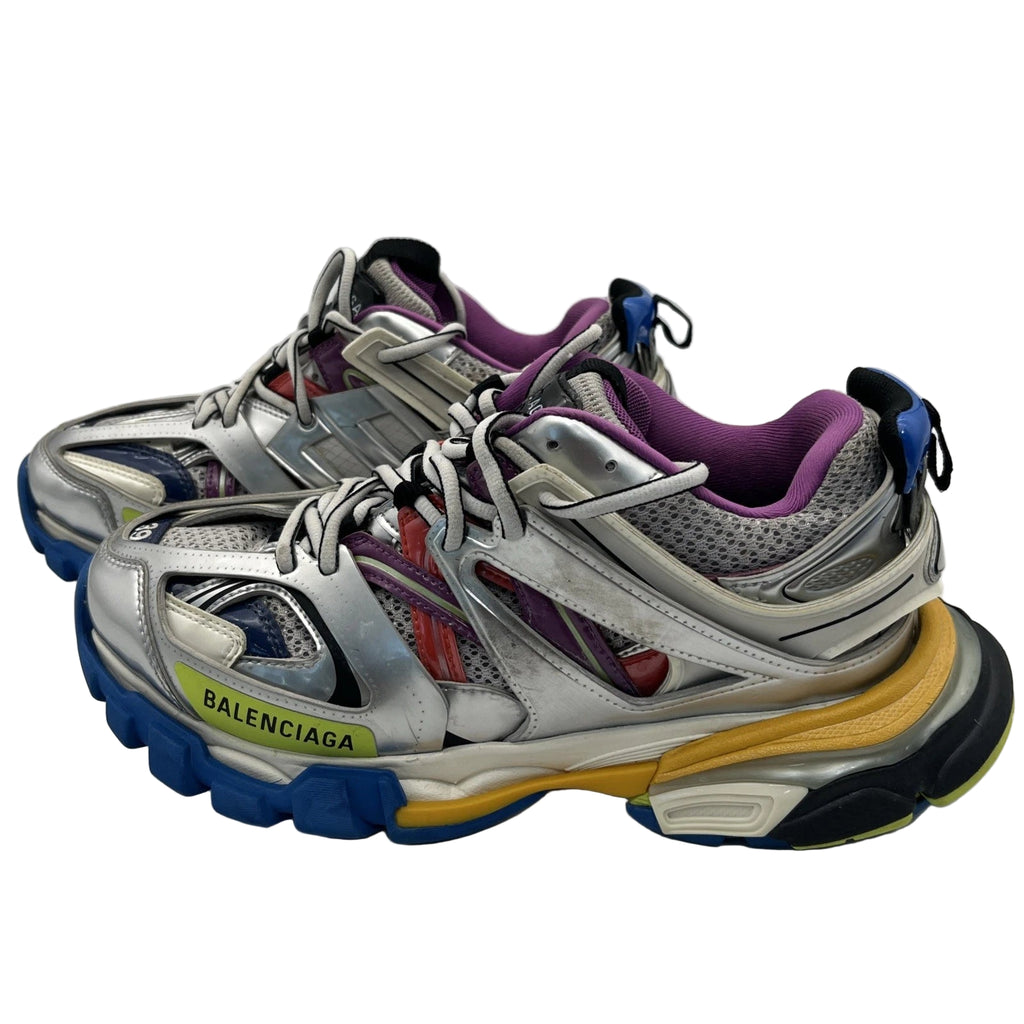 Silver Balenciaga sneakers with colorful soles on a white background