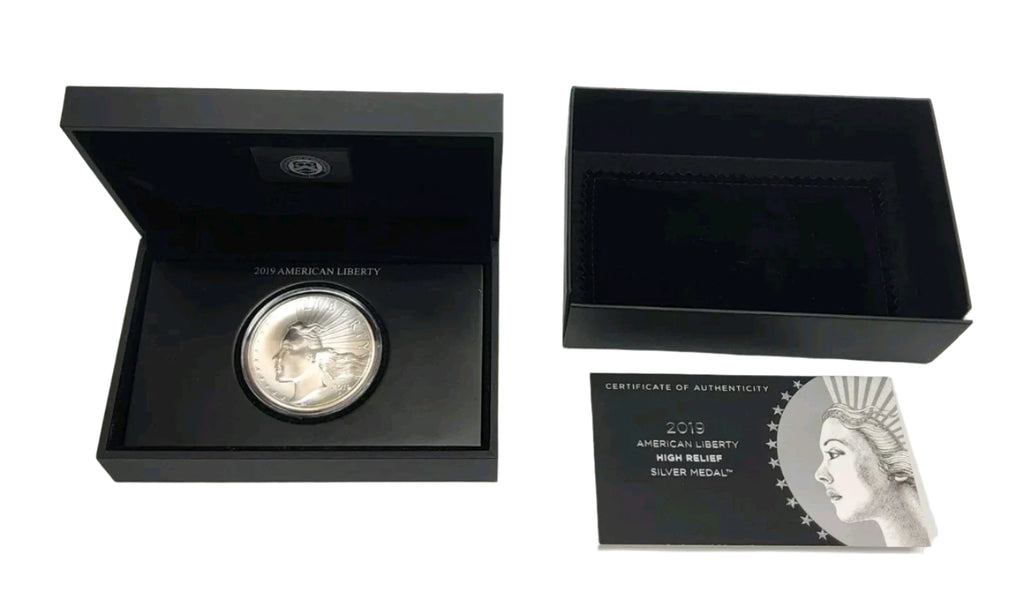 Silver coin with certificate of authenticity in black display box on white background