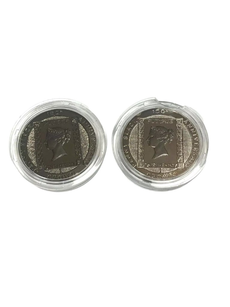 Two coins in protective cases on a white background