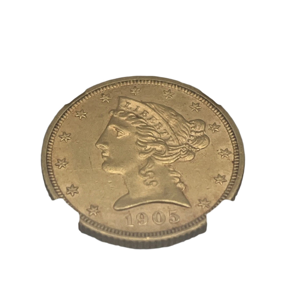 Gold coin with NGC certification on a white background
