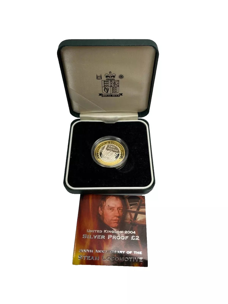 Gold coin in a display case with a certificate on a white background