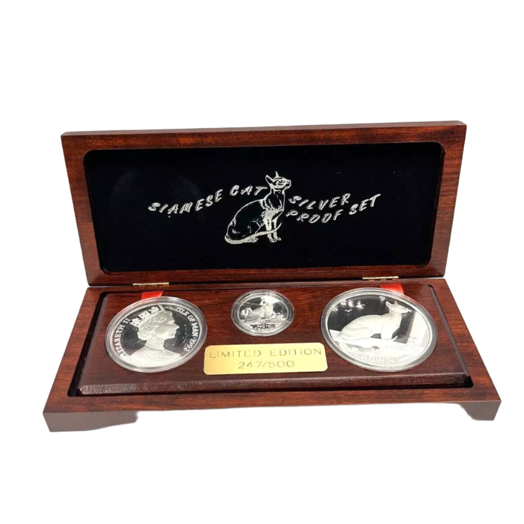 Set of three silver coins in a wooden display case with 'Siamese Cat' branding.